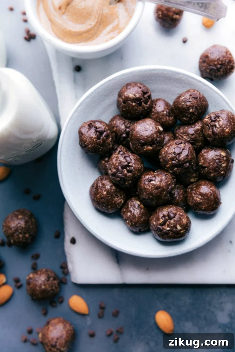 Energizing Chocolate Protein Truffles 2 Delicious Chocolate Protein Balls arranged on a serving plate, ready to enjoy.