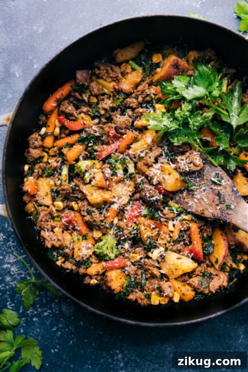 Delicious Overhead View of Sausage and Veggie Skillet: A Perfect Quick & Easy Dinner An inviting overhead shot of the cooked Sausage and Veggie Skillet in a cast iron pan, ready to be served
