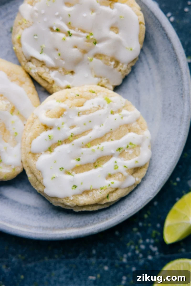 The Absolute Best Lime Cookies: Zesty and Chewy Delicious Lime Cookies with a smooth, glossy glaze and a sprinkle of fresh lime zest as an elegant garnish.