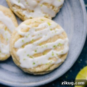 Close-up of a stack of freshly baked Lime Cookies with a glossy glaze.