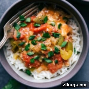 One-Pot Cajun Chicken Feast 2 A delicious bowl of Crockpot Cajun Chicken, rich with vegetables and flavorful broth, ready to be served.