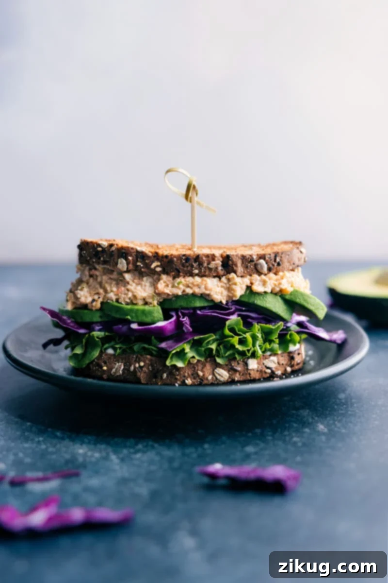 Delicious Buffalo Chickpea Salad Sandwich – a quick, easy, and healthy vegetarian lunch or dinner recipe packed with spicy buffalo flavor. Perfect for plant-based meal prep. A beautifully plated Buffalo Chickpea Salad Sandwich, showcasing the vibrant filling and fresh toppings, ready to be enjoyed as a wholesome meal.