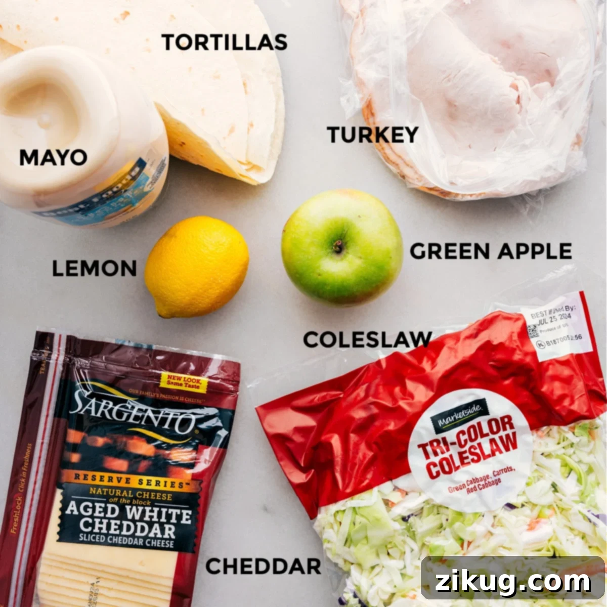 Ingredients In Healthy Turkey Wraps All the vibrant ingredients for Healthy Turkey Wraps neatly arranged on a counter, ready for assembly.