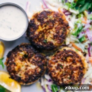 Final plated image of Tuna Patties served with slaw and tartar sauce