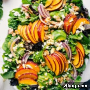 Close-up of the assembled Peach Salad, showcasing the vibrant colors and fresh ingredients ready to be served.