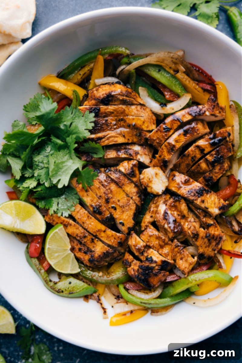 Overhead image of the finished Chicken Fajitas served with a variety of toppings