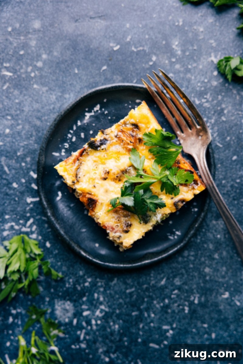 Overhead image of a beautifully sliced, golden-brown Vegetable Frittata on a cutting board, with individual pieces ready to be served