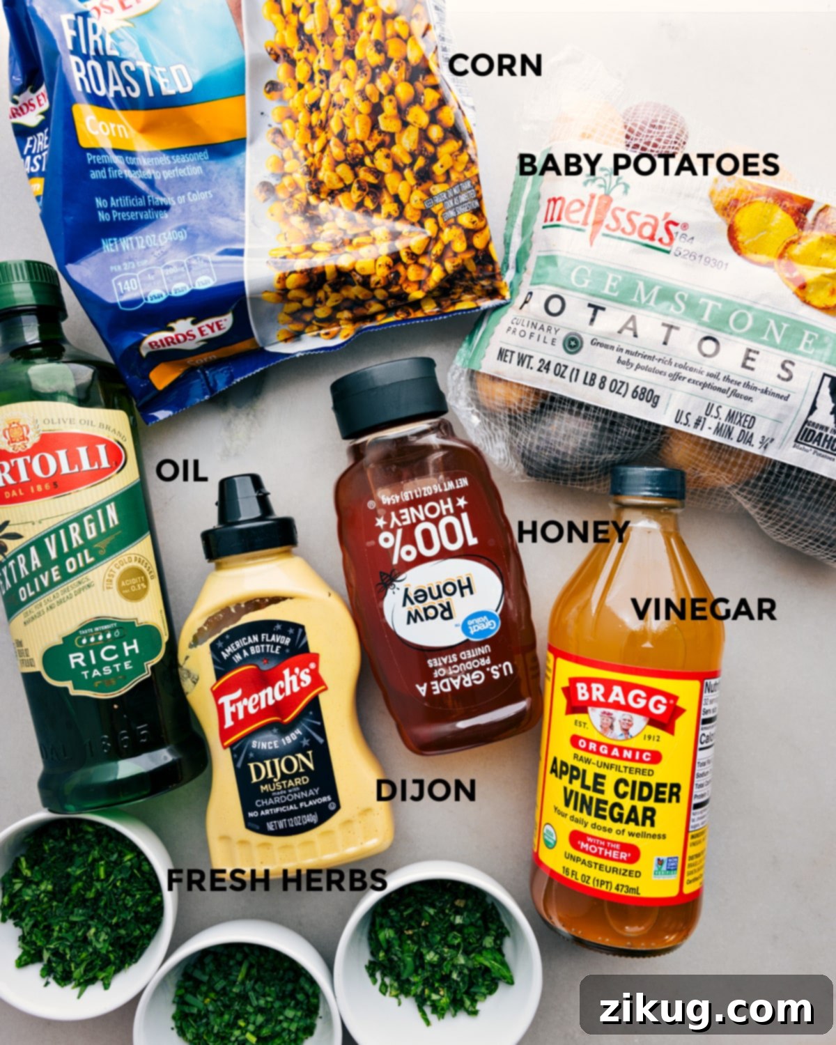 Ingredients In No Mayo Potato Salad Recipe All the ingredients in this recipe including the corn, veggies, oil, dijon, honey, and vinegar prepped out for easy assembly.