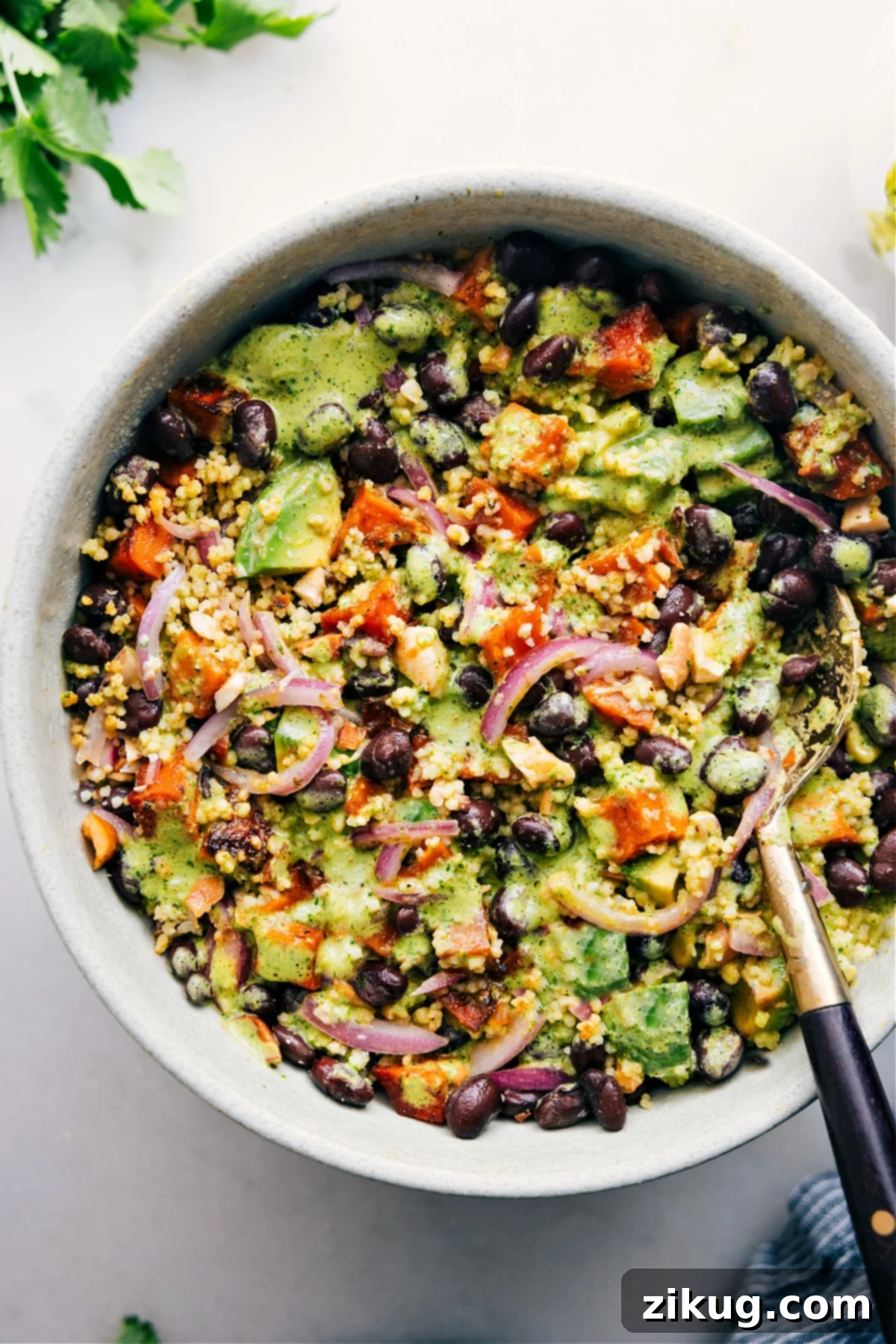 Delicious Sweet Potato Black Bean Salad Recipe A vibrant Sweet Potato Black Bean Salad in a rustic bowl, garnished with fresh cilantro and lime, ready to be enjoyed.