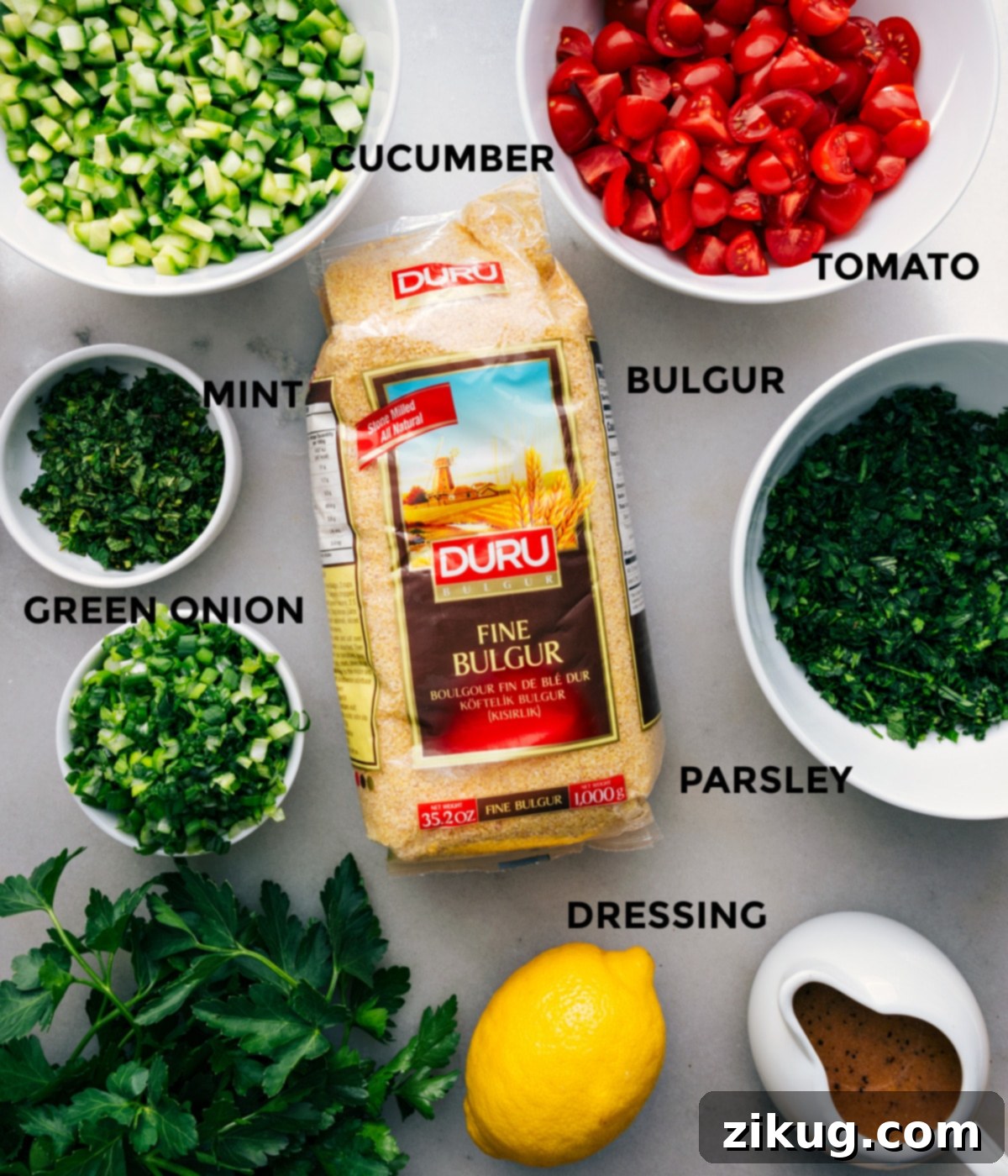 All the fresh ingredients meticulously prepped and laid out for easy assembly: diced tomatoes, vibrant green herbs, crisp cucumber, soaked bulgur wheat, and a tangy dressing.