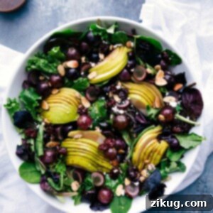 Vibrant Cherry Balsamic Vinaigrette 2 Vibrant pear, grape, and cherry green salad with cherry balsamic dressing on the side, a refreshing delight.