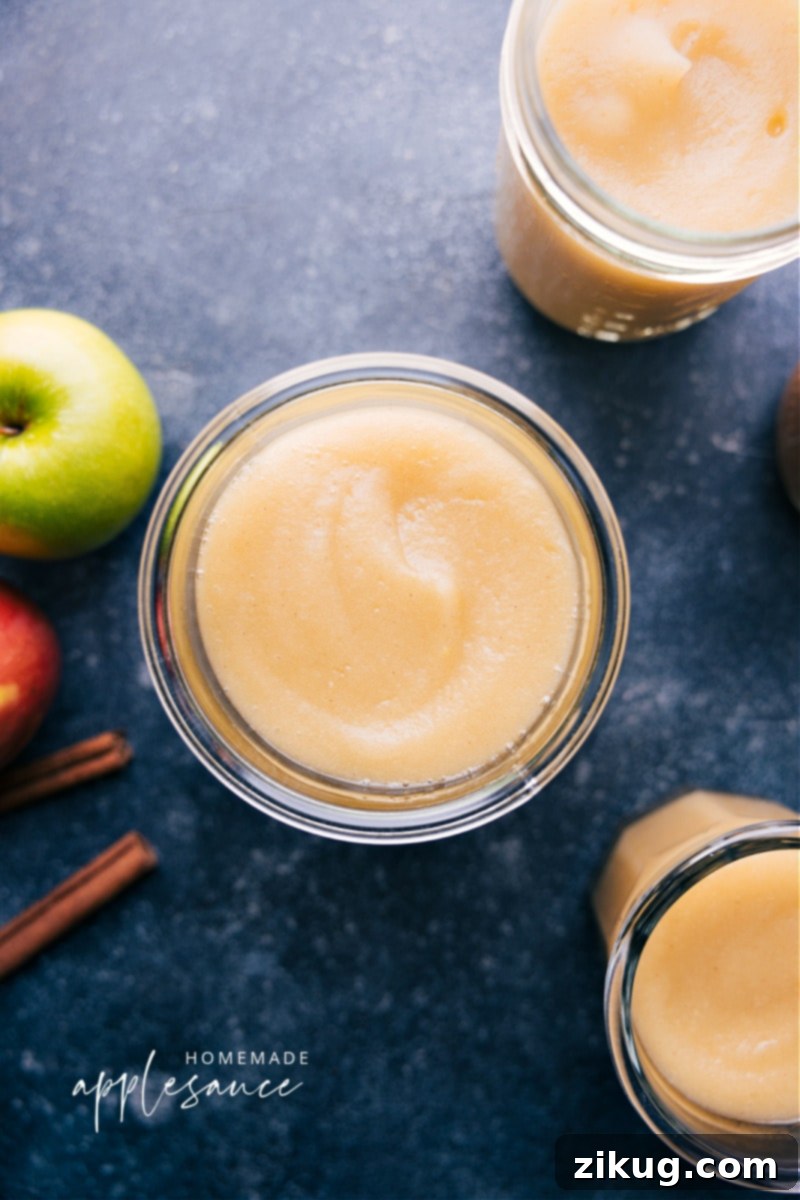 Fresh homemade applesauce in a jar Overhead image of Homemade Applesauce in a glass jar