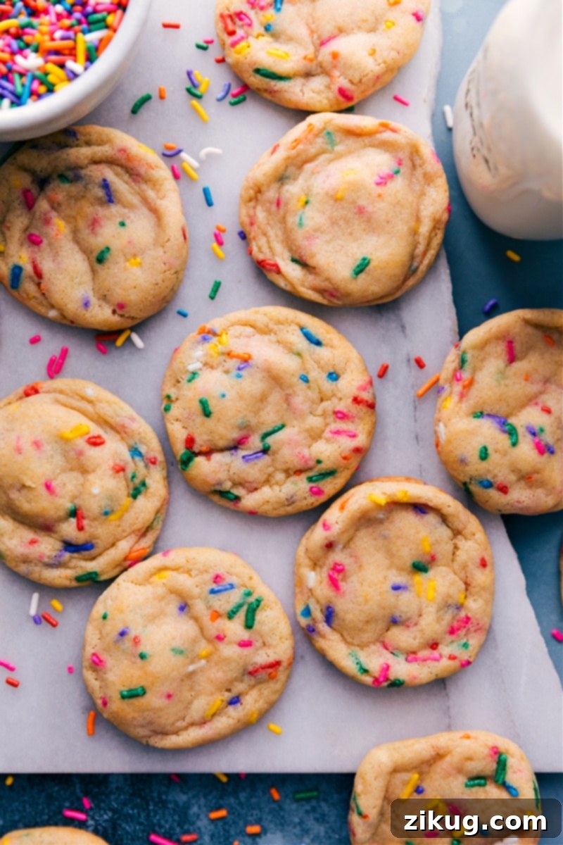 Birthday Cake Cookies 6 A freshly baked batch of Funfetti Cookies, golden brown at the edges and perfectly soft in the center, showcasing their vibrant sprinkles.