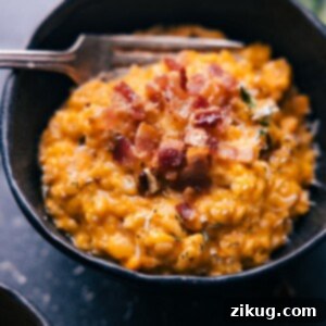 Sweet Potato Risotto garnished with fresh thyme and crispy bacon bits.