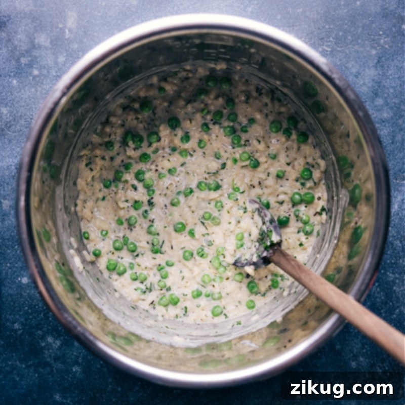 Effortless Velvety Instant Pot Risotto 6 Overhead view of the finished Instant Pot Risotto, still in the pressure cooker pot, indicating it's ready to be served.