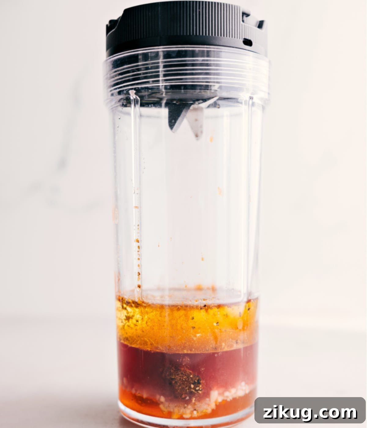 All the vinaigrette ingredients freshly added into a small blender, ready to be processed into a smooth dressing.