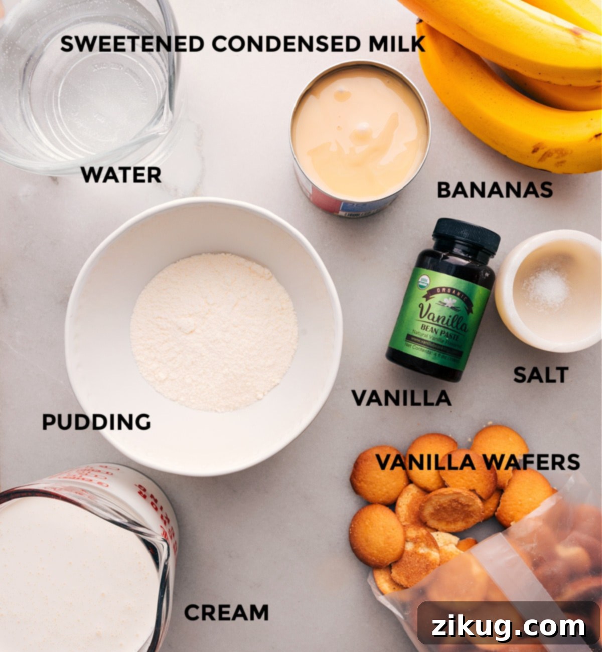 Ingredients for Banana Pudding Recipe An inviting display of essential ingredients laid out, including sweetened condensed milk, classic vanilla wafers, rich heavy cream, pure vanilla extract, and ripe bananas, all poised to be transformed into this delightful banana pudding dessert.