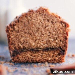 Sliced Cinnamon Bread on a wire rack, showing the swirl and crumb.
