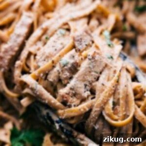 Creamy Chicken Alfredo Recipe garnished with fresh parsley.