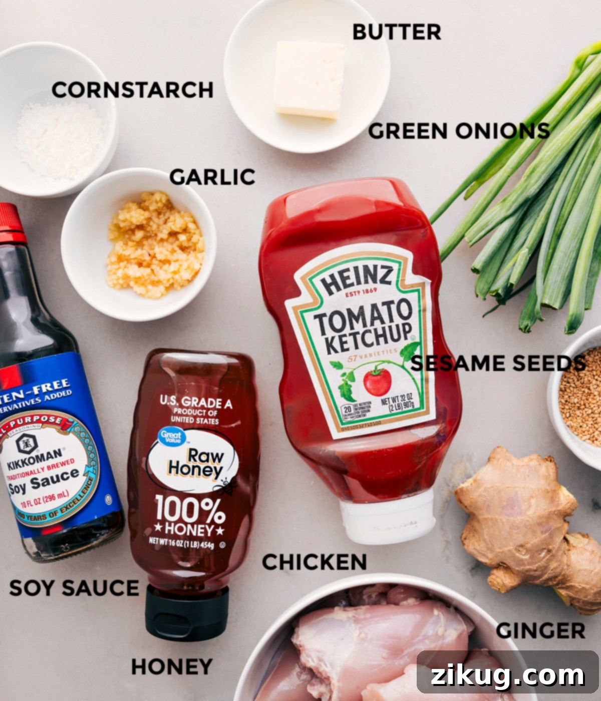 Ingredients In Honey Garlic Chicken Thighs All the essential ingredients for making delicious Honey Garlic Chicken Thighs: chicken, butter, green onions, garlic, cornstarch, ketchup, honey, soy sauce, sesame seeds, and ginger, meticulously prepped and ready for assembly.