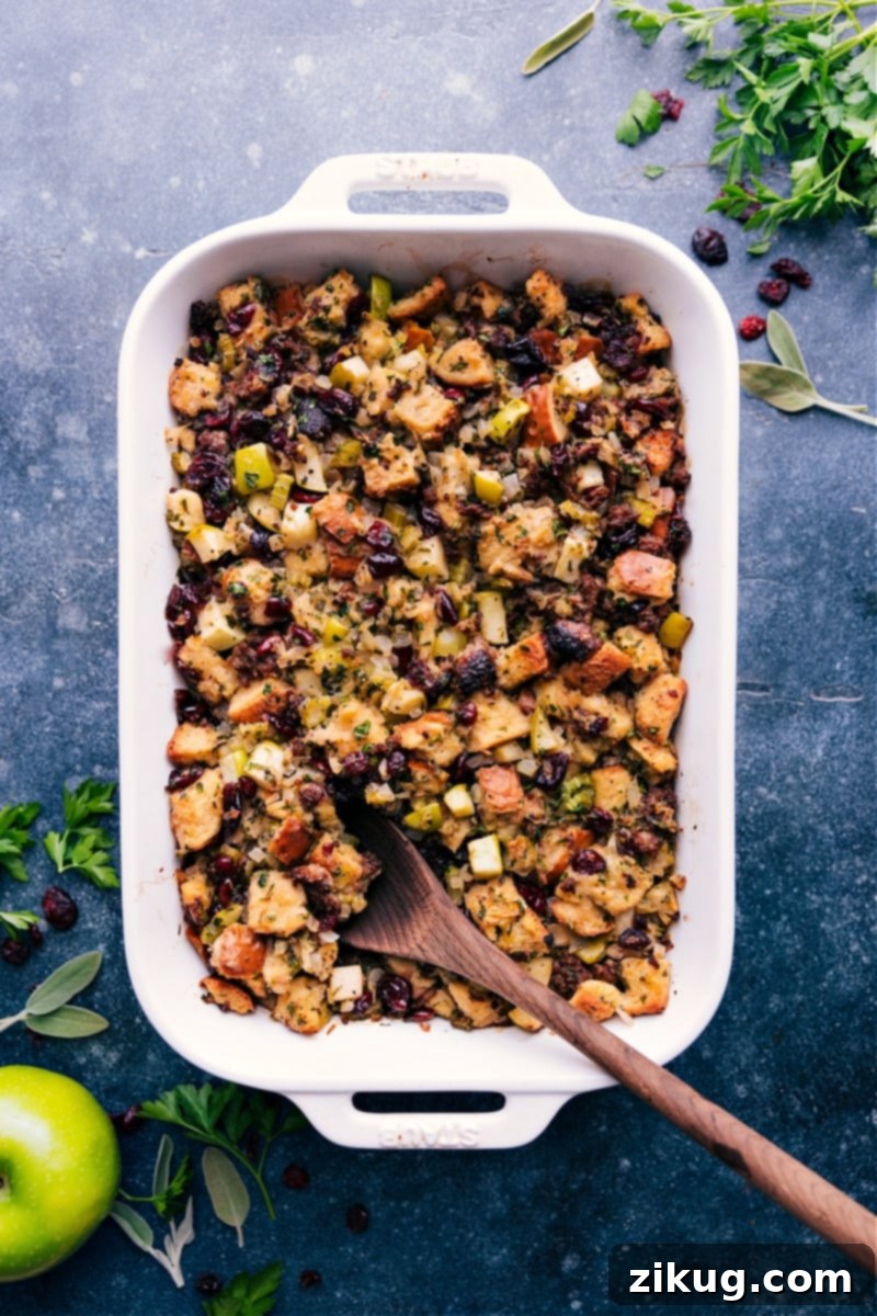 The Best Sausage Stuffing Recipe: Italian Sausage, Apples, Cranberries, and Sage Overhead image of the Sausage Stuffing recipe, showcasing its golden-brown top and rich ingredients