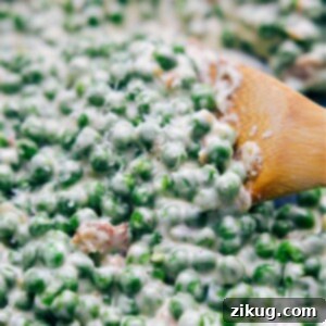 Velvety Creamed Peas 3 Creamed Peas in a bowl, garnished