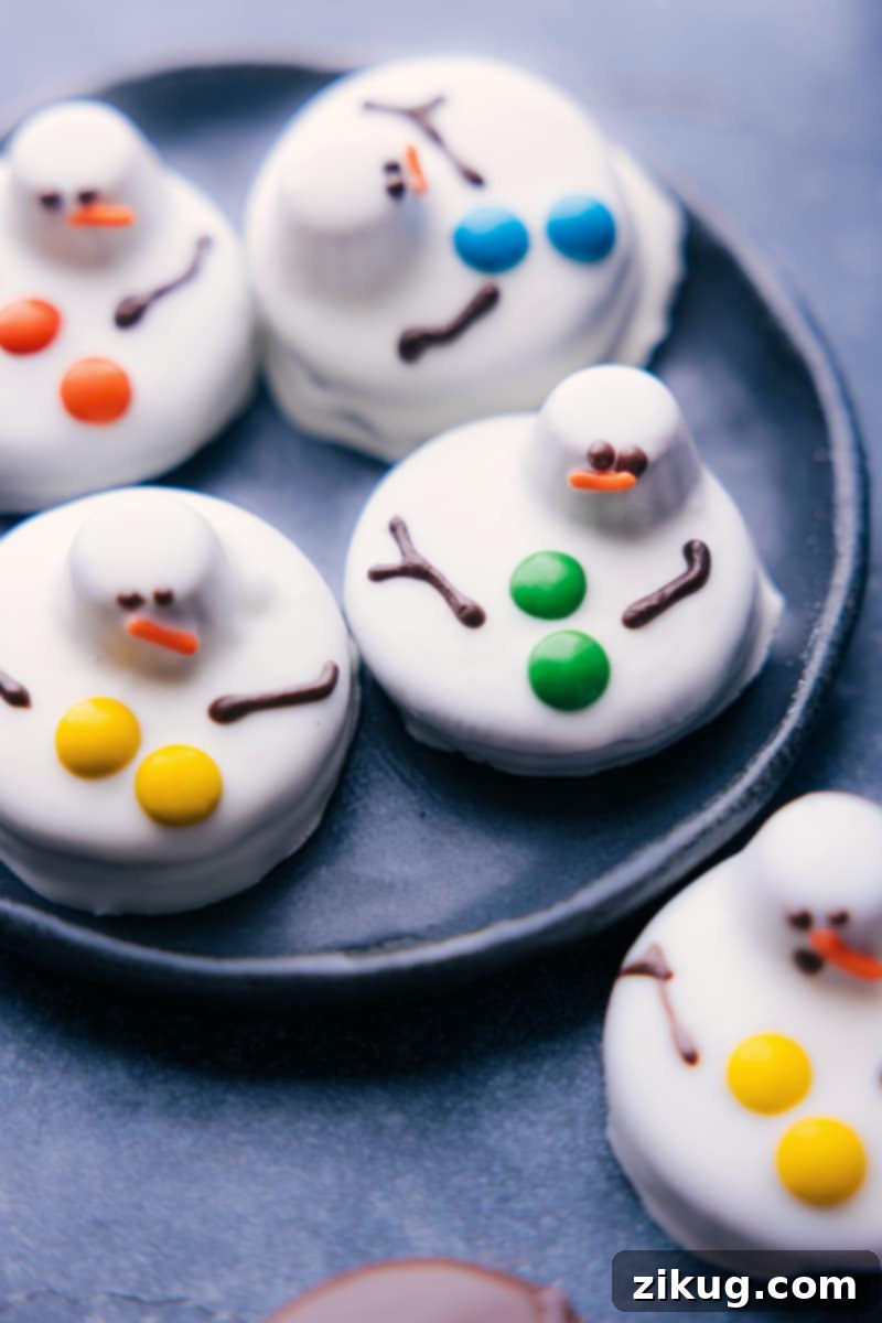 Overhead image of a tray of melted snowman Christmas Oreos, showcasing their cute and playful design.