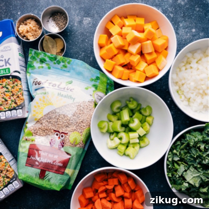 A flat lay image showcasing all the fresh, colorful ingredients required for making Barley Soup, neatly arranged on a rustic surface.