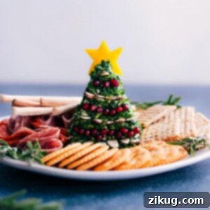 A beautifully decorated Christmas Cheeseball, ready for serving.