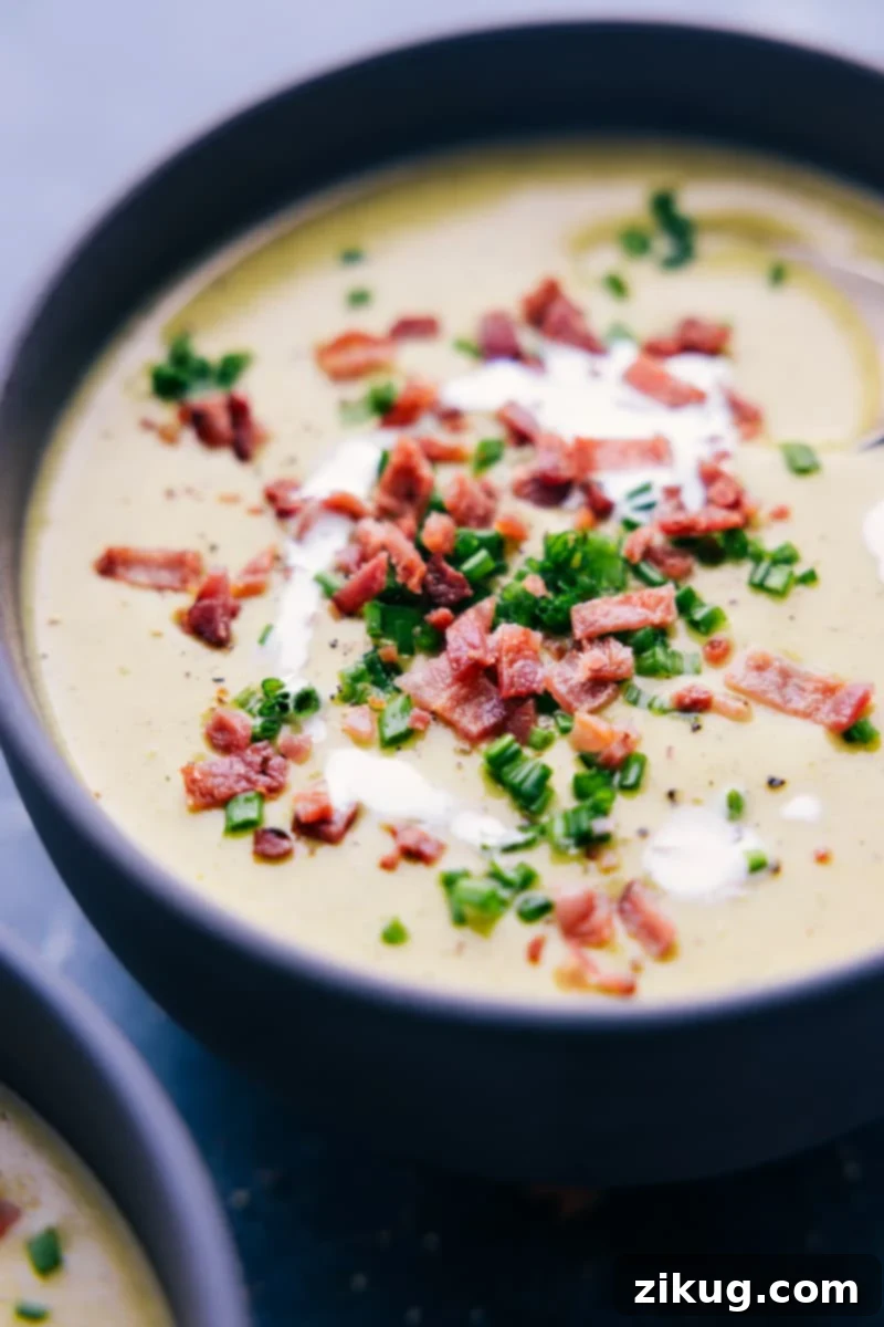 A beautifully plated bowl of creamy Broccoli Soup, garnished and ready to be enjoyed.