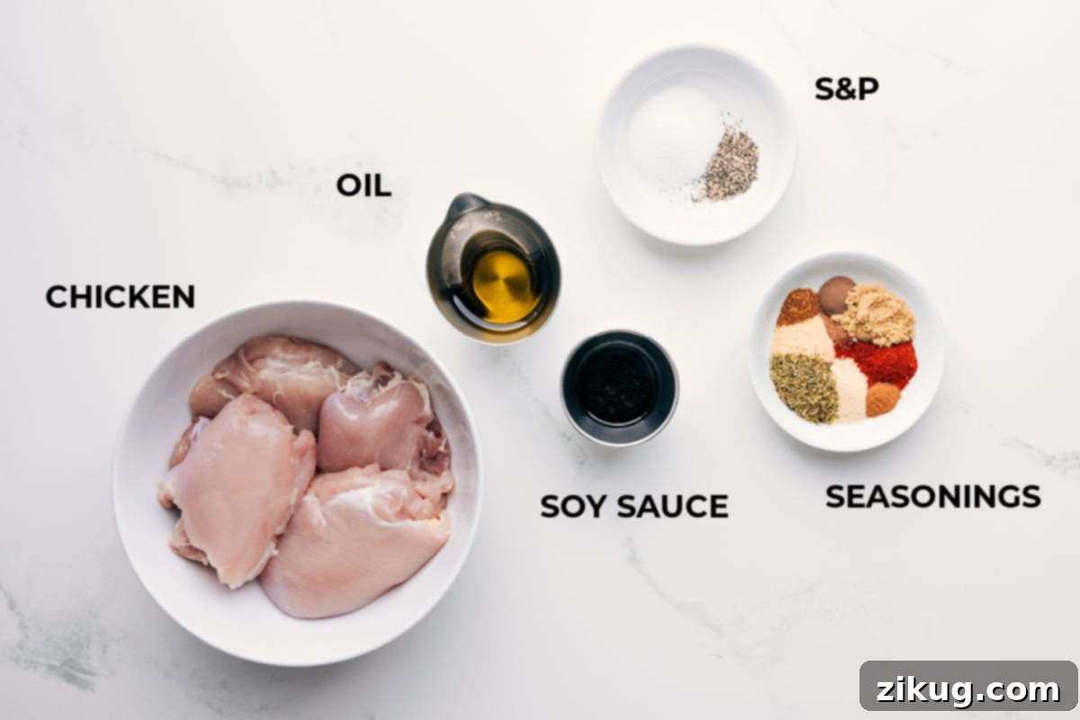Essential Ingredients for the Best Jerk Chicken Recipe Prepped ingredients for easy assembly including raw chicken, olive oil, soy sauce, and a variety of seasonings laid out on a wooden board.