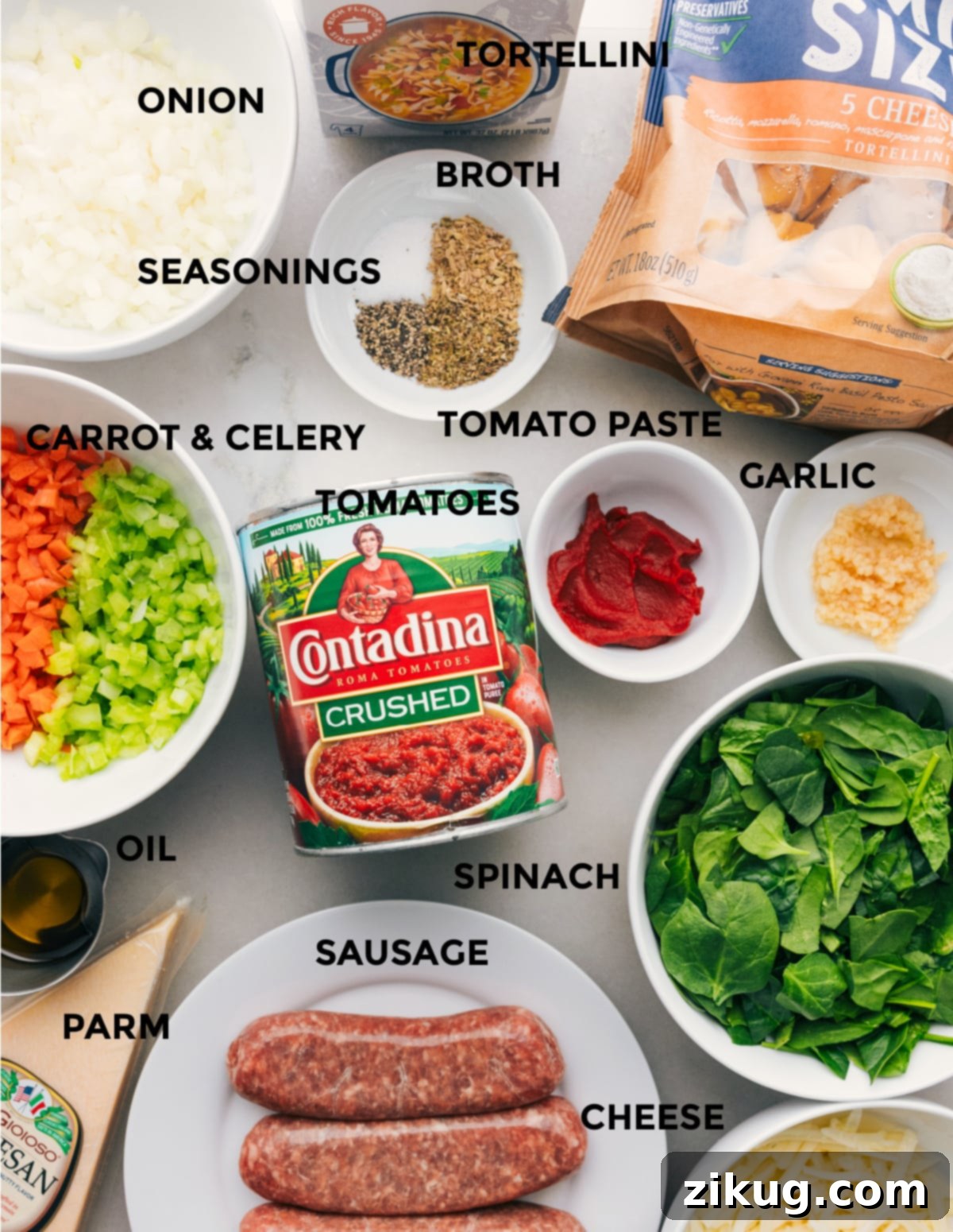 Ingredients In Baked Tortellini All the fresh ingredients used in this recipe prepped out for easy assembly, including herbs, cheeses, sausage, and vegetables.