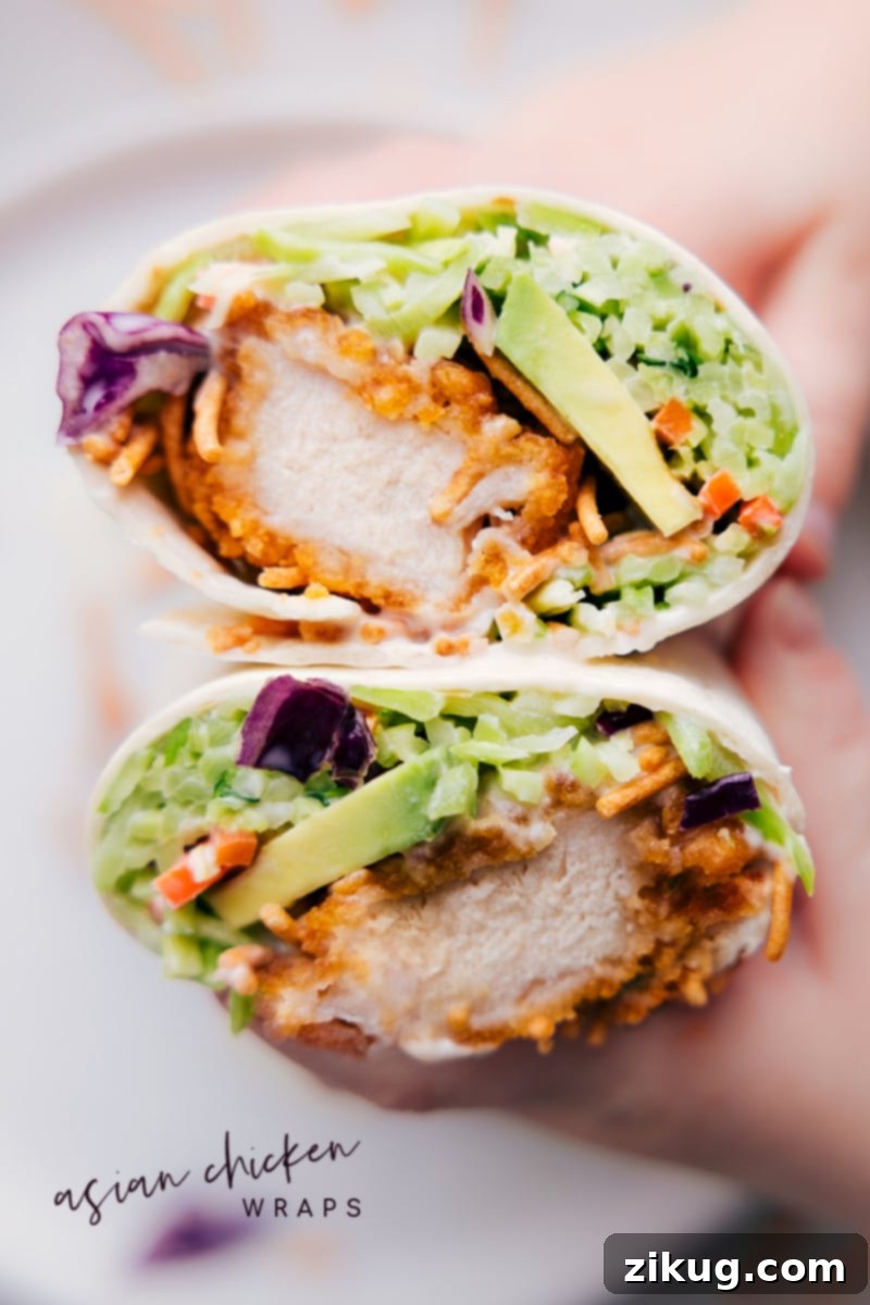 Absolute Best Asian Chicken Wraps for Any Meal Delicious Asian Chicken Wraps, expertly cut in half, revealing their flavorful, crispy filling and vibrant colors.