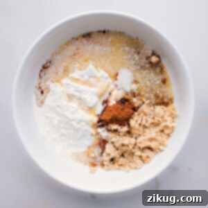 Combining flour, brown sugar, cinnamon, and salt in a bowl for streusel