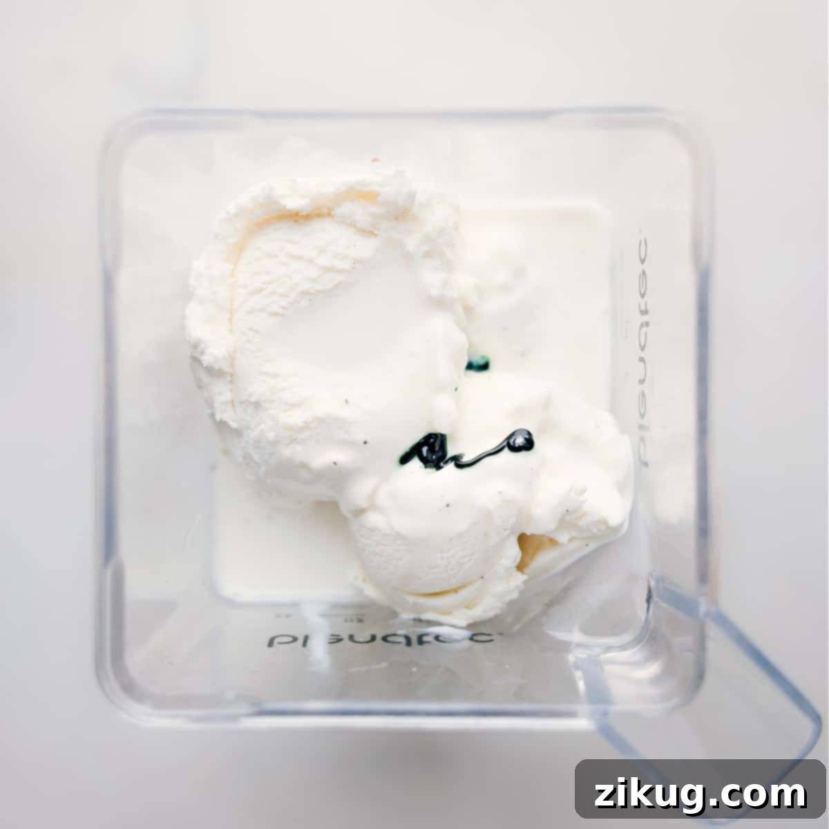 Simple Steps To Make Homemade Shamrock Shakes All the essential ingredients for the Shamrock Shake—vanilla ice cream, milk, mint extract, food coloring—being poured into a blender.