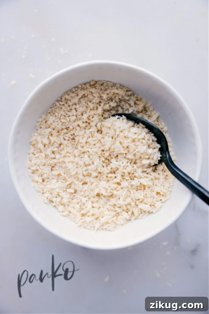 Image of golden panko breadcrumbs in a rustic bowl, ready for cooking