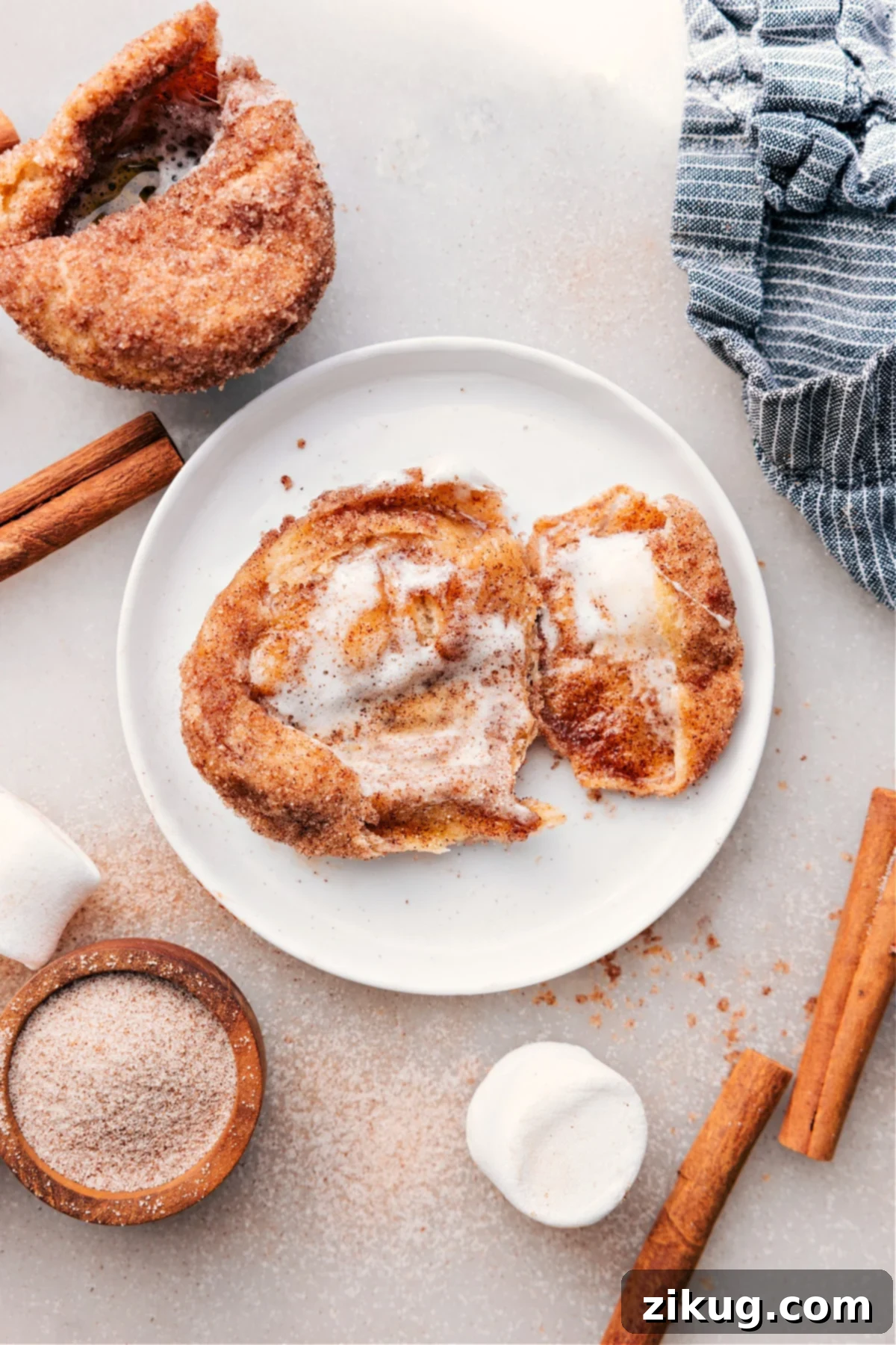 Delicious Empty Tomb Rolls: The Perfect Easter Treat A plate of freshly baked Empty Tomb Rolls with their hollow centers clearly visible, lightly dusted with cinnamon sugar, ready to be enjoyed.