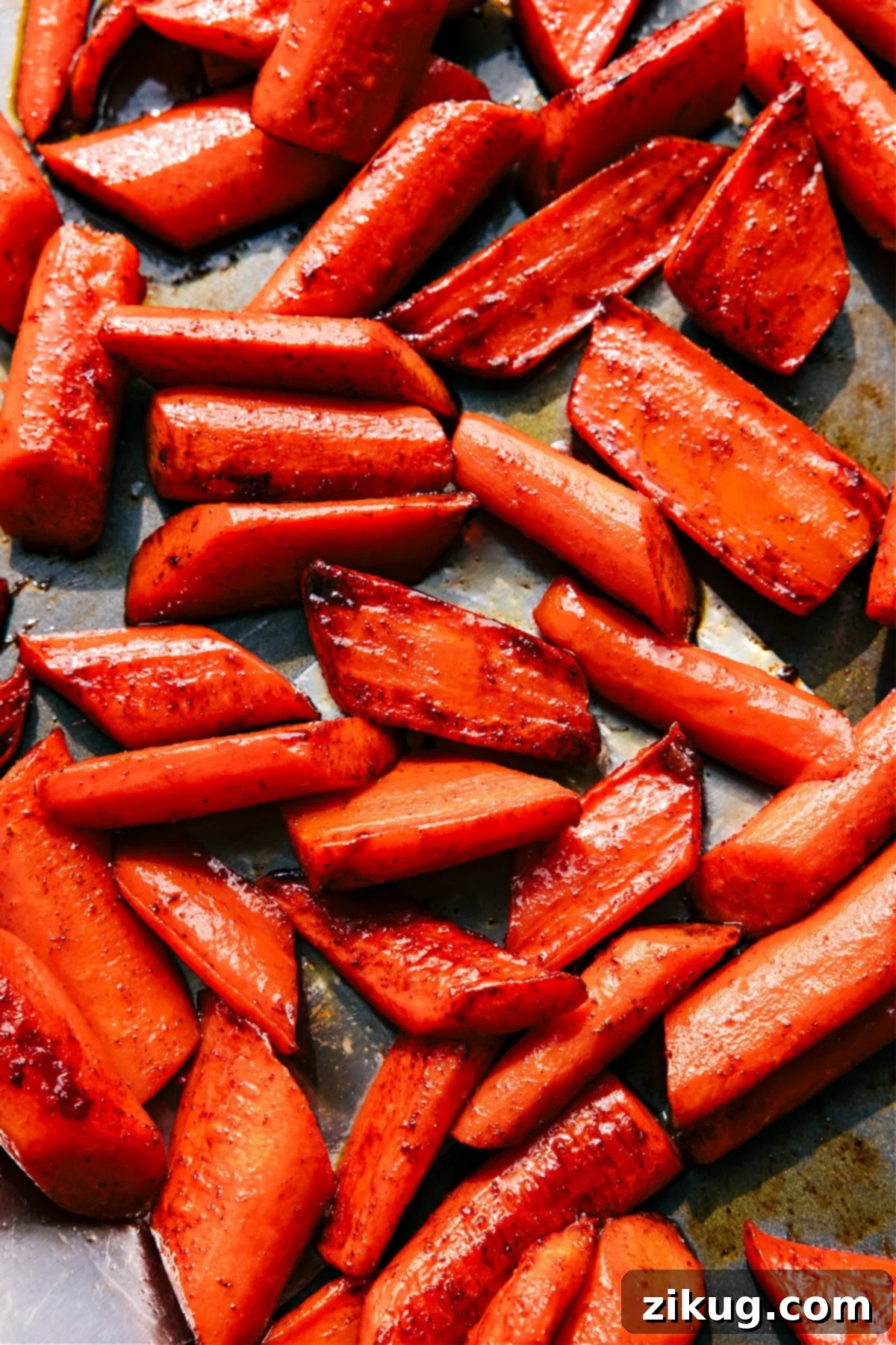 Brown Sugar Roasted Carrots on the sheet pan ready to be enjoyed, showcasing their rich, caramelized glaze and tender texture.