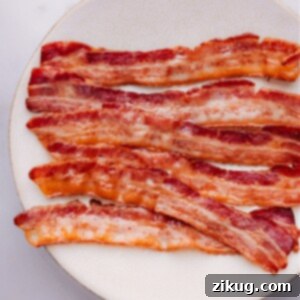 Delicious oven-baked bacon, perfectly crispy and golden brown.
