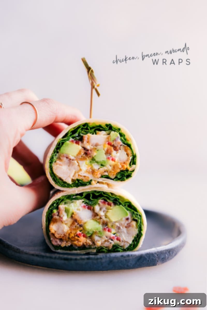 Stacked Chicken Bacon Avocado Wraps showcasing the fresh ingredients and golden-brown tortillas