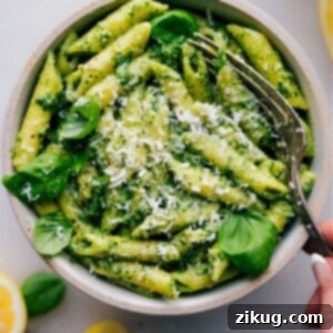 Pesto Pasta Perfection 3 Close-up of a serving of Pesto Pasta, showing the rich green sauce and texture of the pasta.