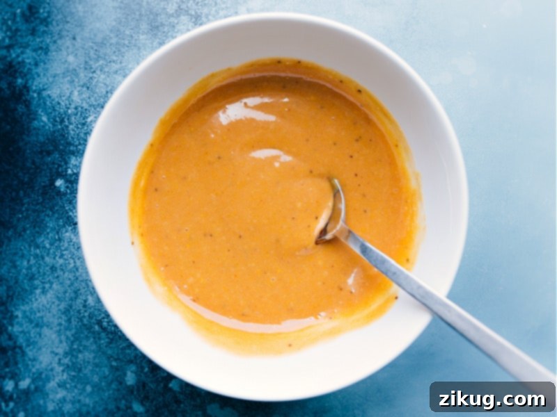 Perfectly mixed and ready to enjoy, this homemade Chick-Fil-A Sauce is irresistible! #dippingsauce #homemadechickfila Image of the Chick-Fil-A Sauce all mixed together in a bowl, ready to serve