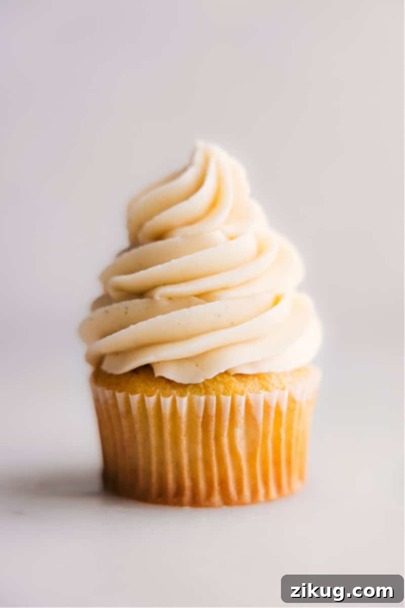 Easy Homemade Vanilla Frosting for Cakes and Cupcakes A perfectly frosted vanilla cupcake, ready to be enjoyed, showcasing the smooth and pipeable texture of the homemade vanilla frosting.