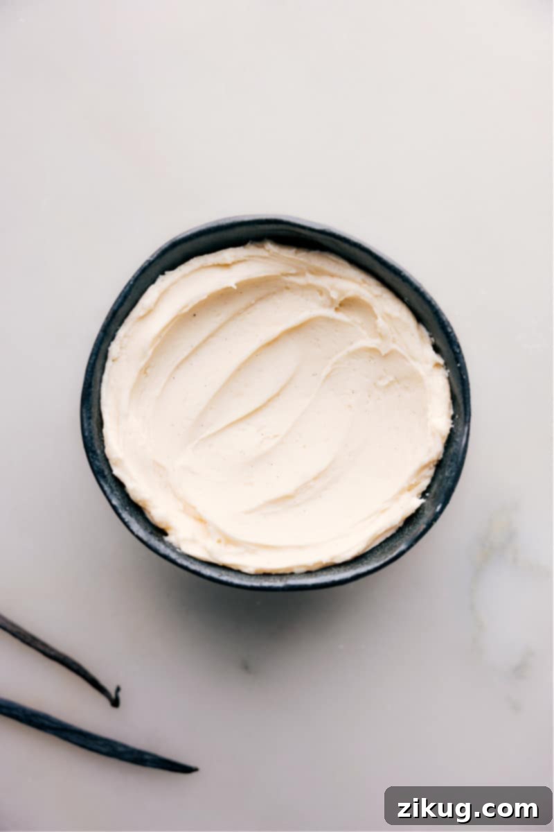 Bowl of Freshly Made Vanilla Frosting An overhead view of a bowl filled with freshly made vanilla frosting, showcasing its inviting creamy white texture.