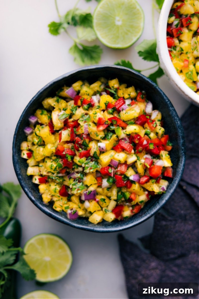 Refreshing Pineapple Salsa Ready to Serve Overhead close-up image of a beautifully arranged bowl of refreshing Pineapple Salsa, ready to be served.
