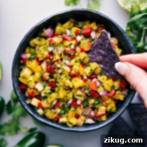 A close-up image of fresh pineapple salsa in a white bowl, ready for serving.