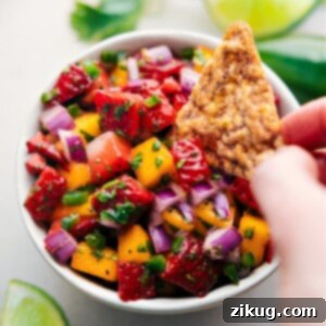 A beautifully presented bowl of Strawberry Mango Salsa, vibrant and fresh, perfect for any occasion.