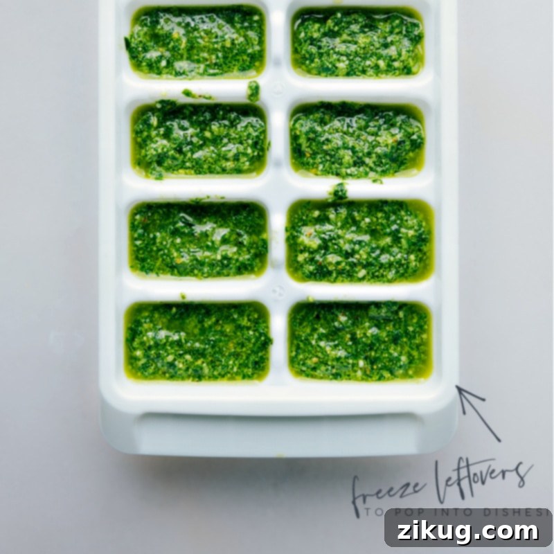Image demonstrating optimal storage of Pesto Recipe leftovers in an airtight container, covered with a thin layer of olive oil to prevent oxidation