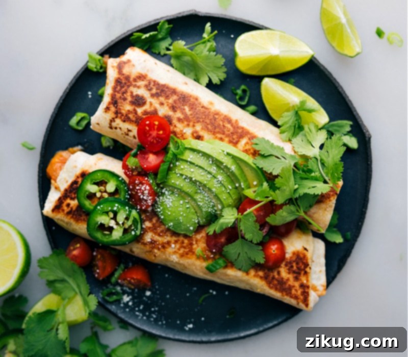 Perfectly Topped Bean Burrito: Ready to Enjoy! Overhead image of a fully topped bean burrito ready to be enjoyed