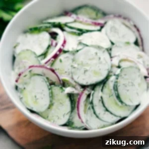 Creamy Cucumber Salad recipe in a bowl ready to be enjoyed.